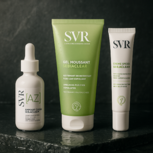 A premium, reworked packshot for SVR Sebiaclear collection, showcasing the products heroically against a moody, wet stone surface that evokes purity and efficacy. The lighting is soft, with a direction from the upper left, casting gentle shadows. The products are arranged elegantly, following the rule of thirds, shot at eye level with a 100mm lens at f/8. The color palette is derived from the products' packaging, featuring soft greens and whites, ensuring photorealism with an editorial magazine quality. Format 1:1. no AI artifacts, no warped or smeared text, no fake words, no invented logos, no plastic/waxy look, no doll-like skin, no oversaturated HDR, no stock-photo feel, no watermark, no extra fingers, no melted geometry.